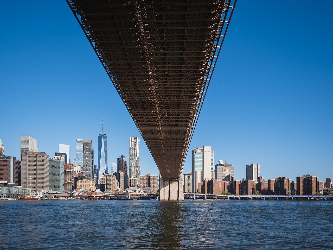 Lower Manhattan seen from under the deck of the Brooklyn Bridge