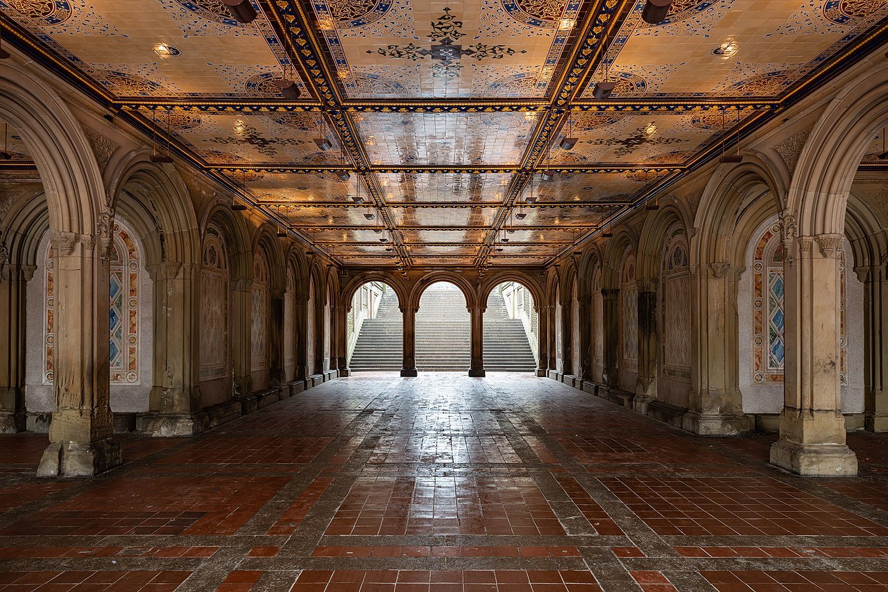 The tiled ceiling of the Bethesda Terrace arcade, the steps rising to the light