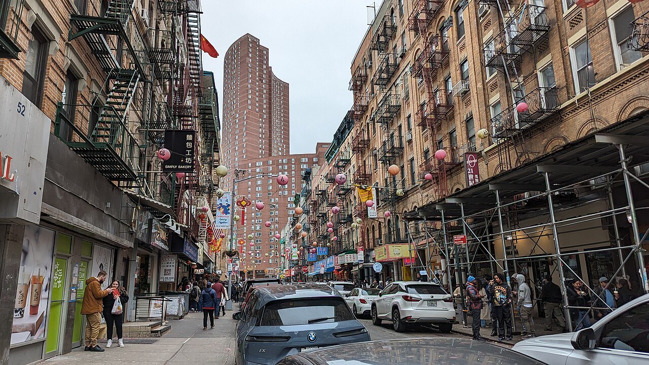 Bayard Street's tenements and fire escapes on a cloudy day