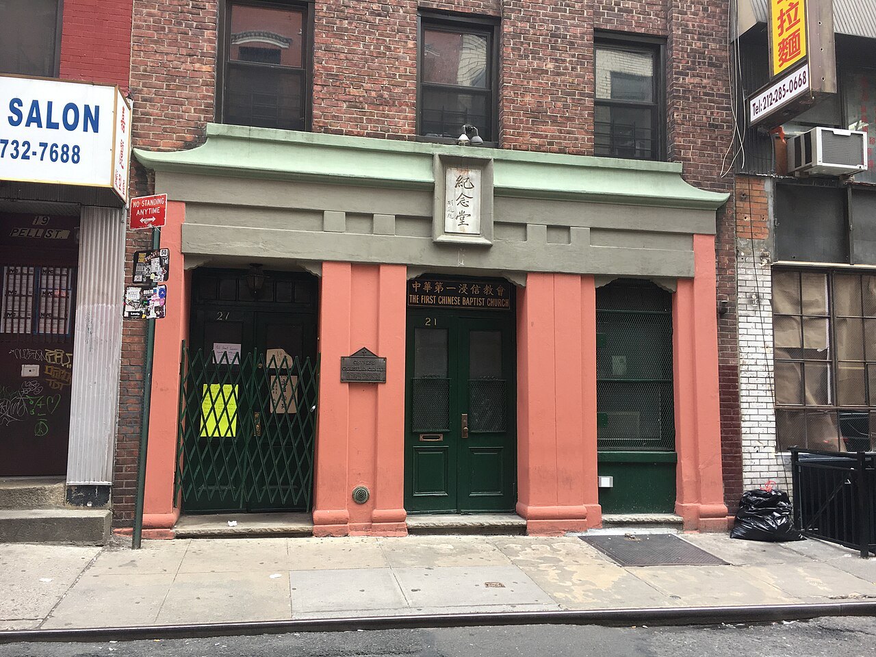 The red-painted front of the Chinese Baptist church on Pell Street