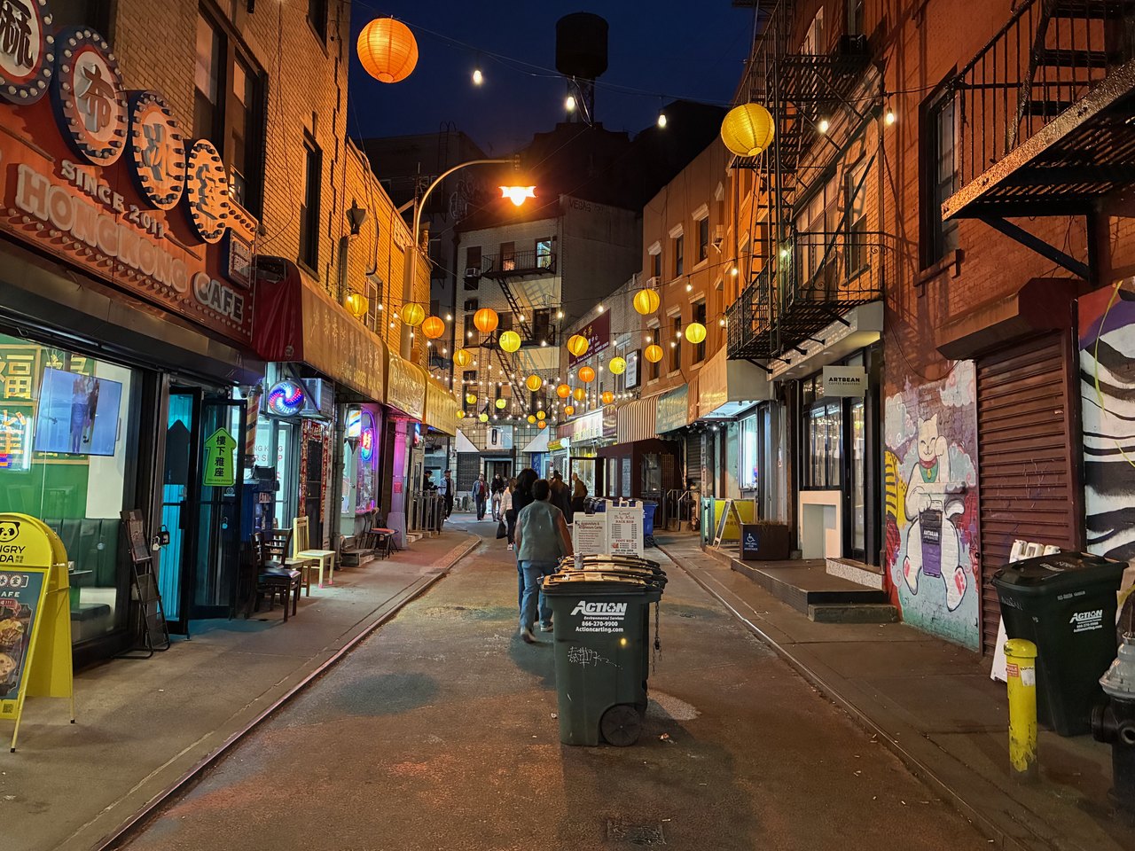 Lanterns strung over a Chinatown side street at night