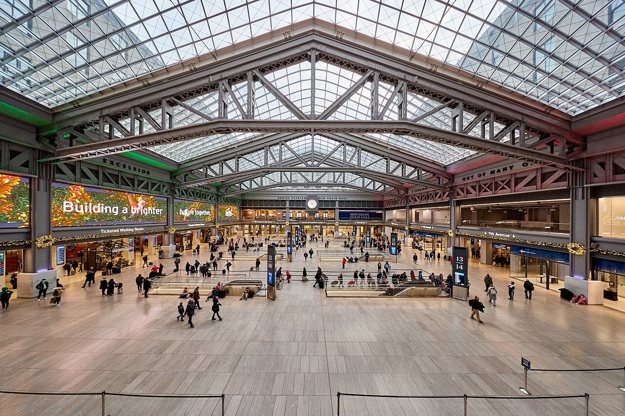The concourse of Moynihan Train Hall from above, under its glass roof