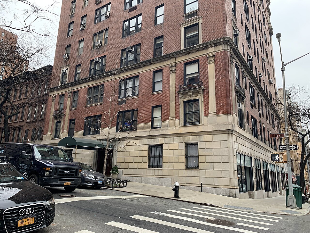 A brick apartment house on the corner of East 94th Street and Lexington Avenue
