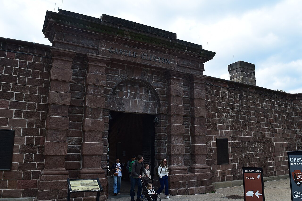 The arched sandstone entrance of Castle Clinton in Battery Park