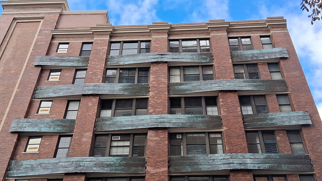The old brick factory walls of Chelsea Market, with iron balconies