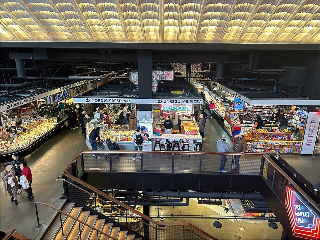 The food stalls of Essex Market seen from the mezzanine