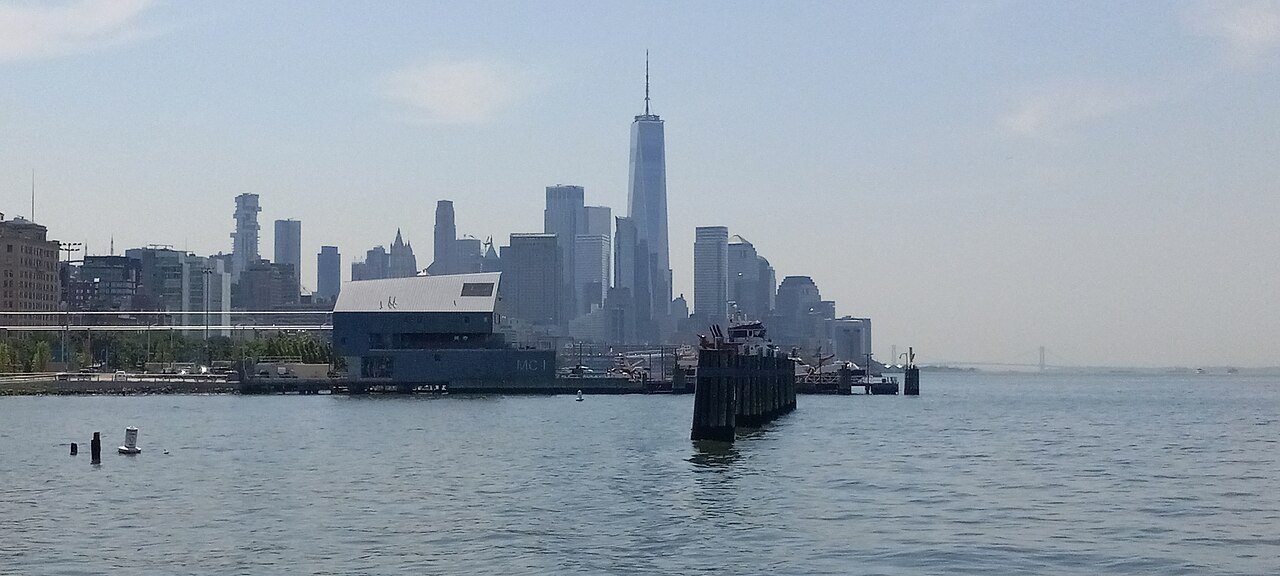 Lower Manhattan's skyline across the harbor on a hazy day