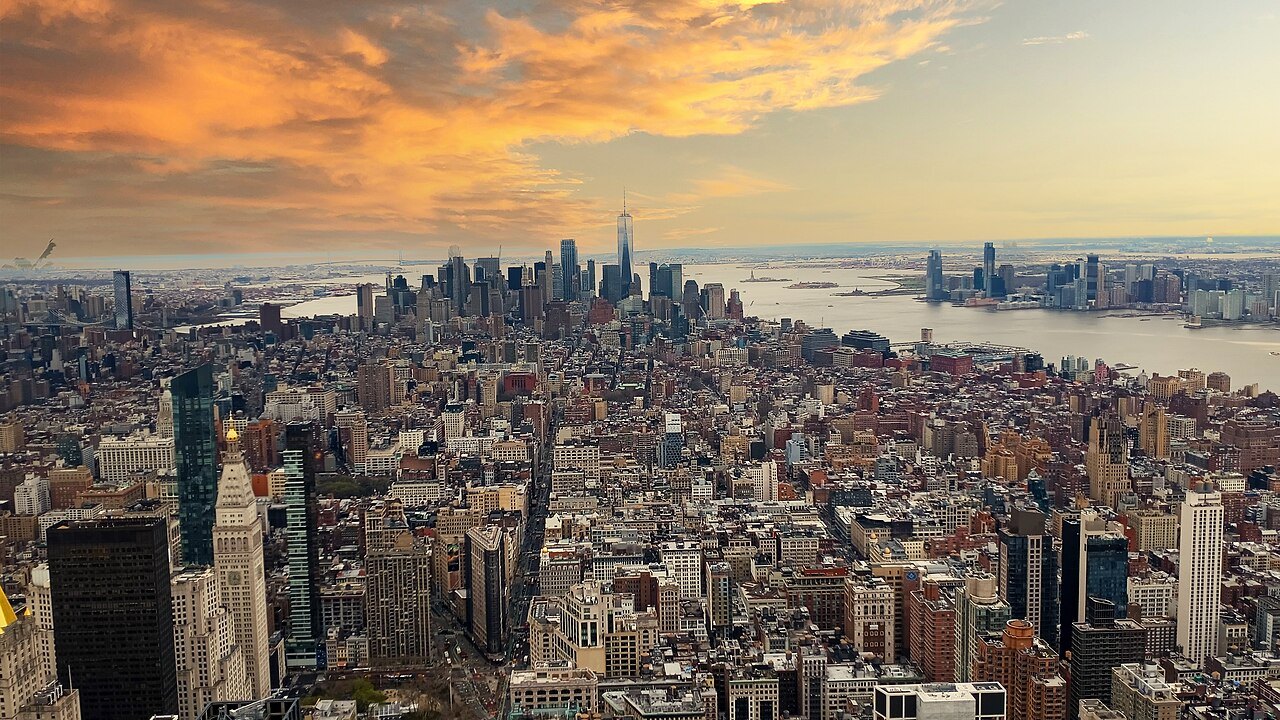Lower Manhattan and the harbor at sunset, seen from high above Midtown