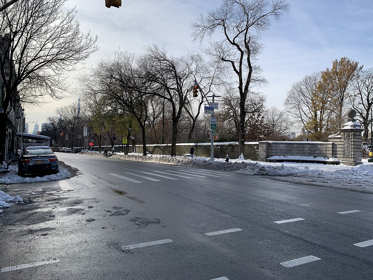 A wet, snowy Fifth Avenue at Engineers' Gate in winter