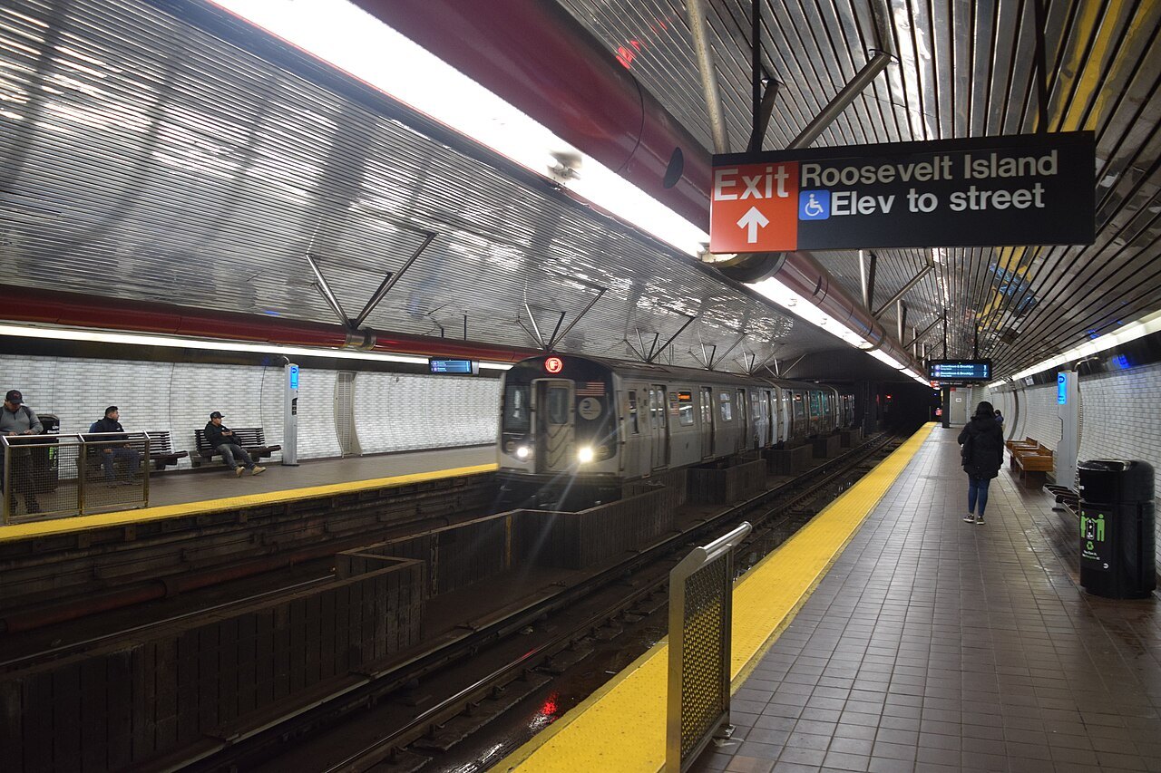 A train at the Roosevelt Island subway platform, deep below the river