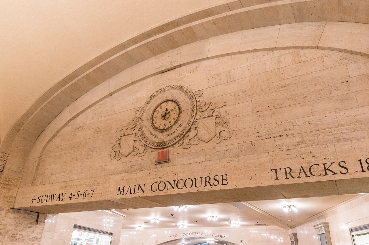 A carved clock over the passage to the tracks inside Grand Central