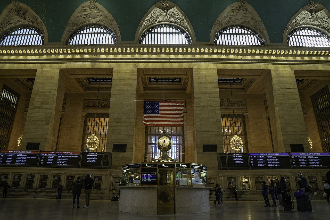 The information booth and its clock under the concourse's arched windows