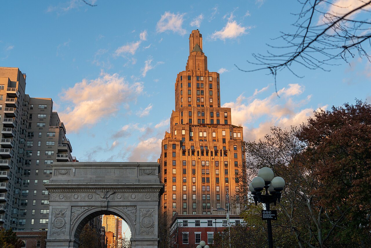One Fifth Avenue glowing at sunset above the Washington Square Arch