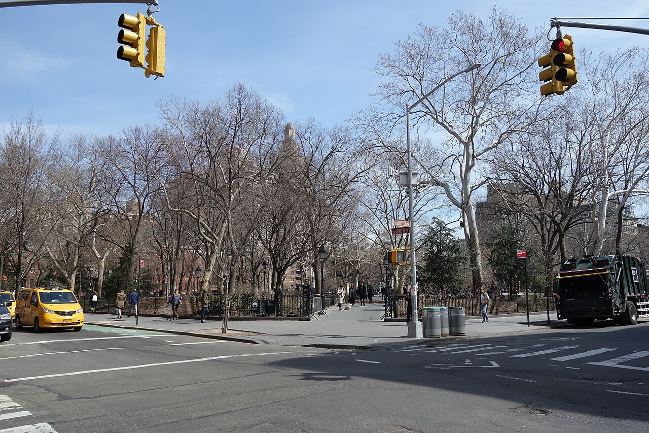 The edge of Washington Square Park in winter, the trees bare