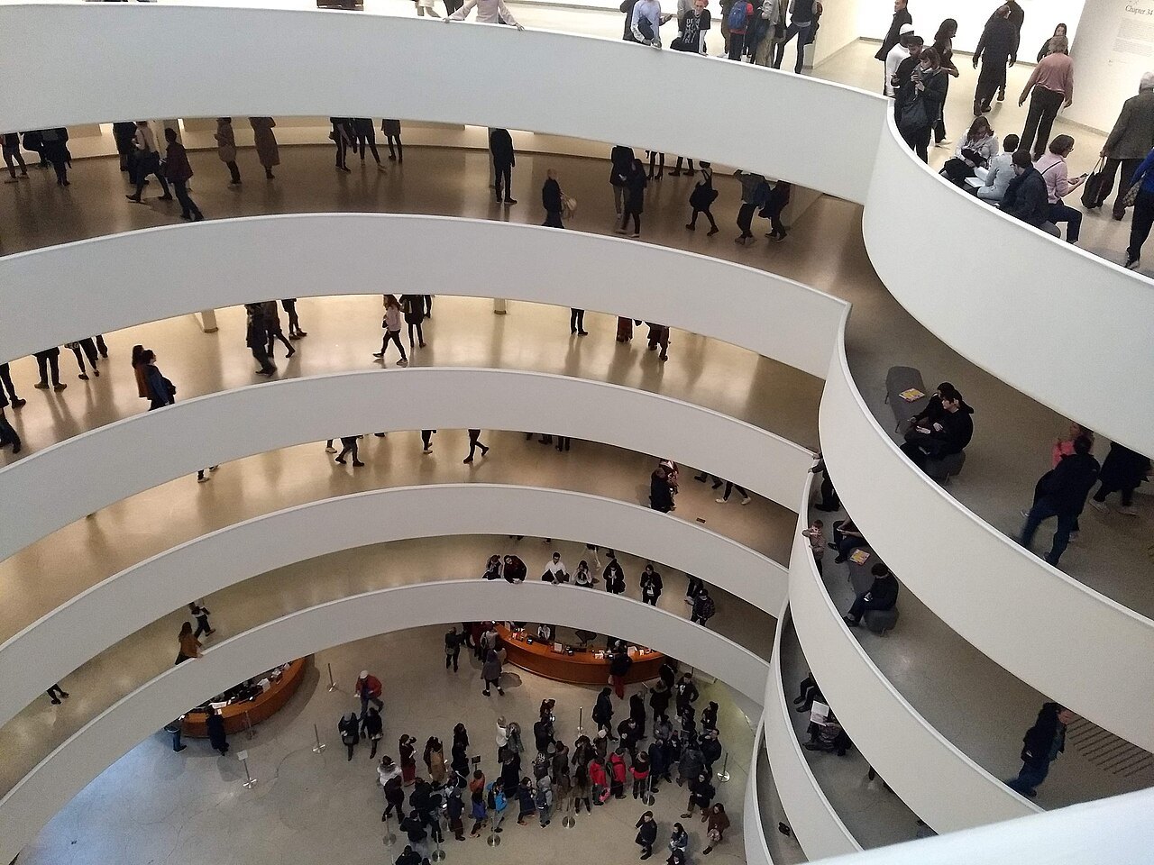 Visitors on every turn of the Guggenheim's ramp, looking down into the rotunda