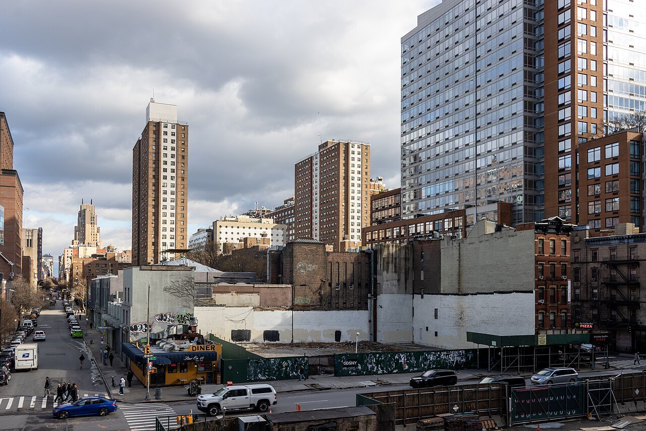 Chelsea's towers and warehouses from the High Line, looking up the avenue