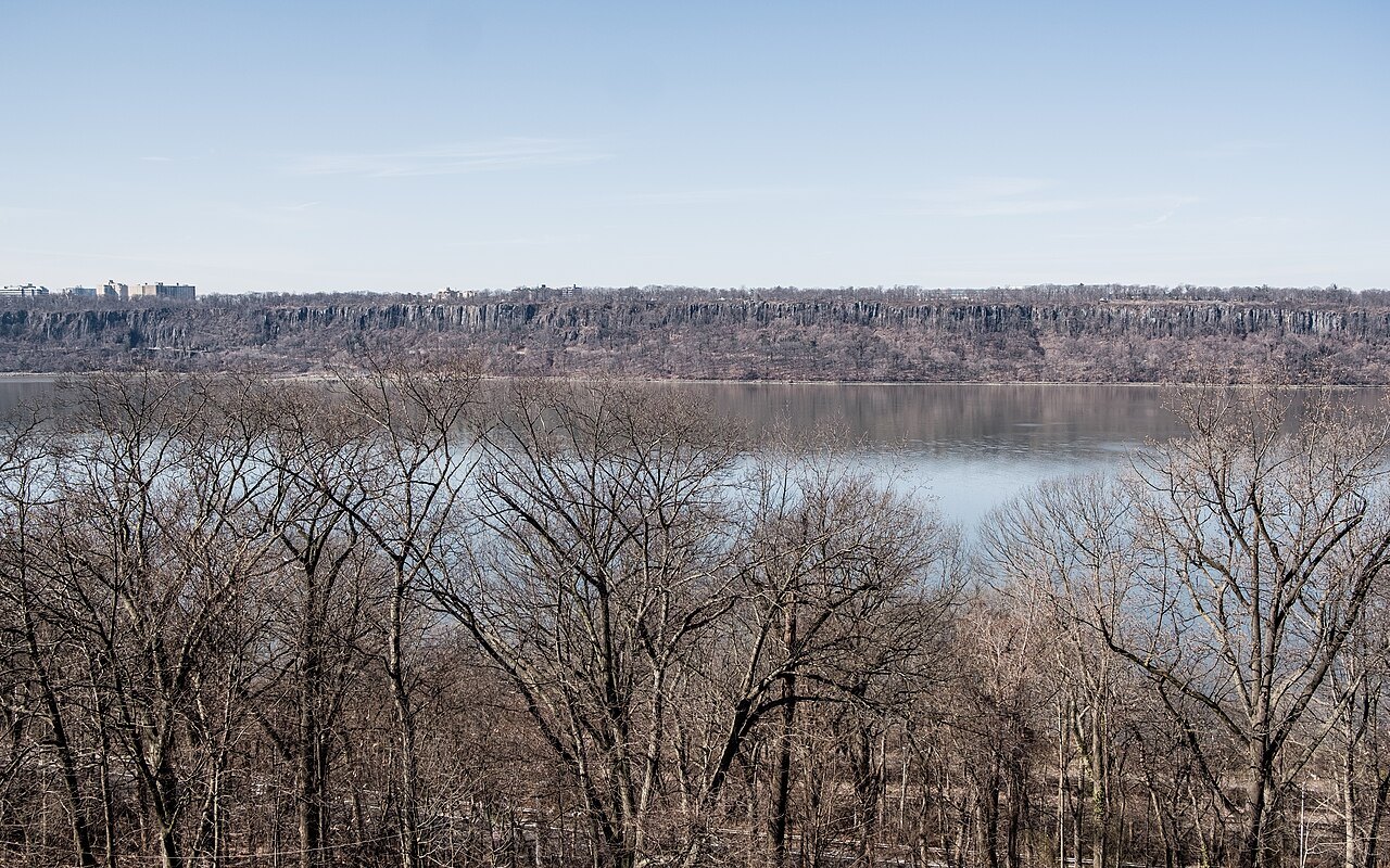 The Hudson and the Palisades through bare trees in Fort Tryon Park