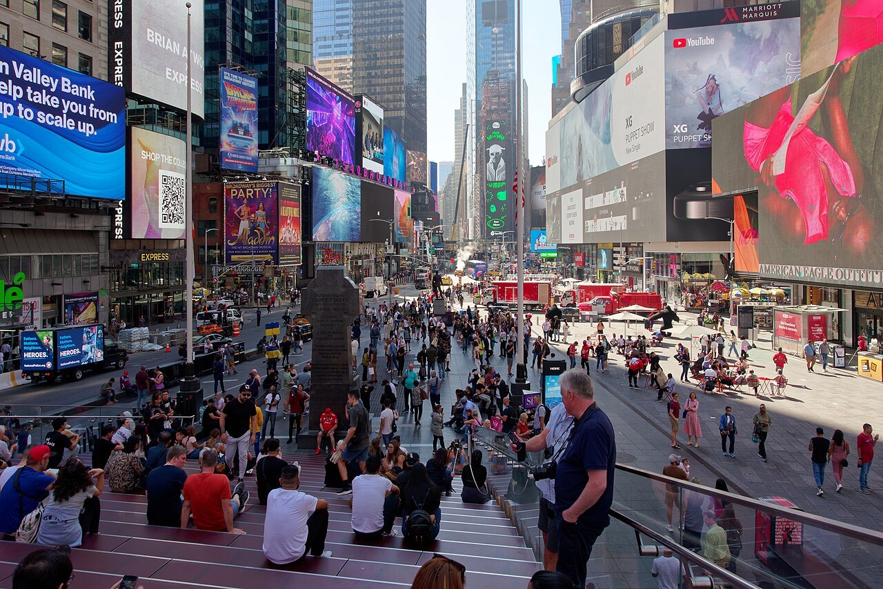 Crowds on the red steps and plazas of Times Square