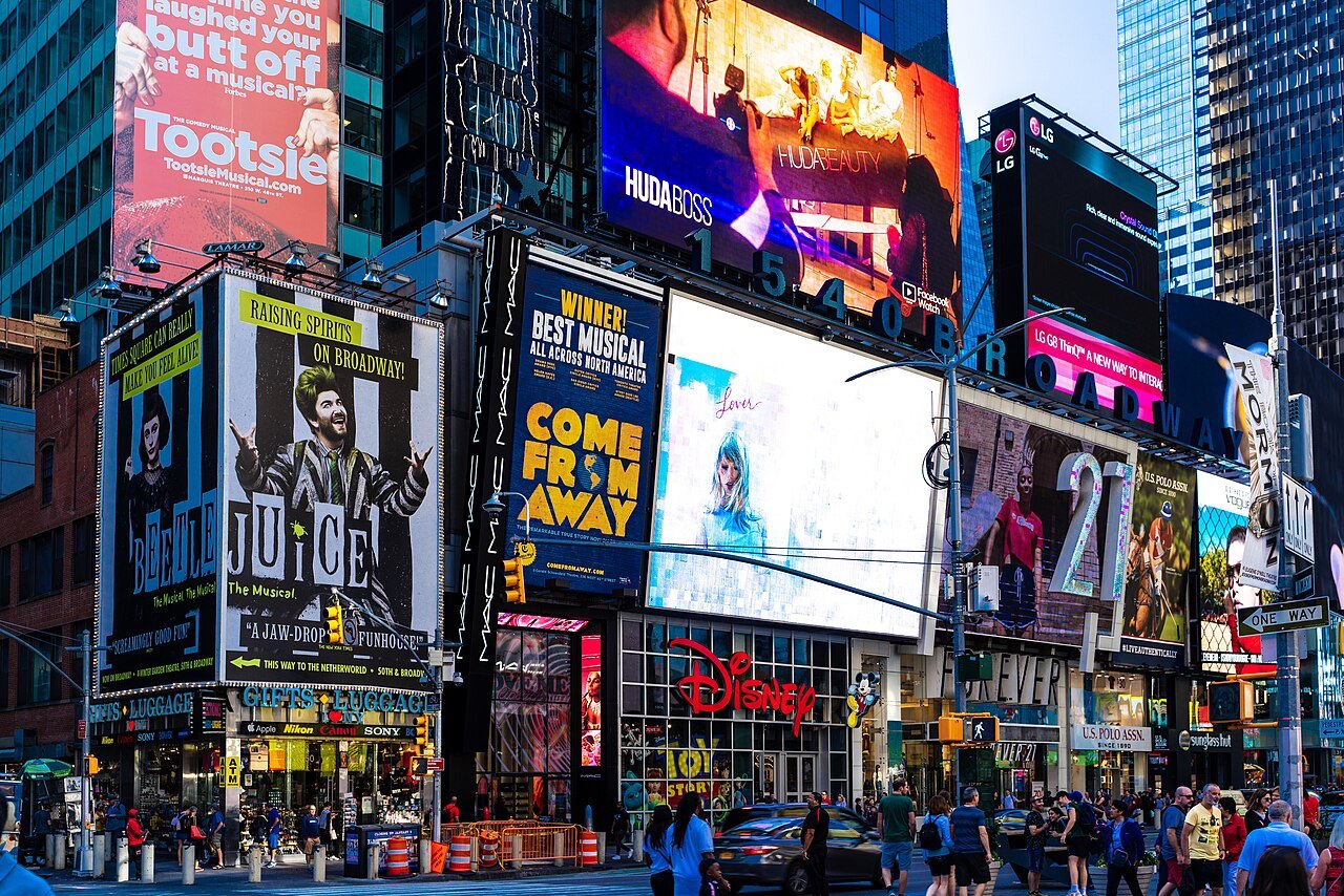 The signs and screens of Times Square stacked up the buildings