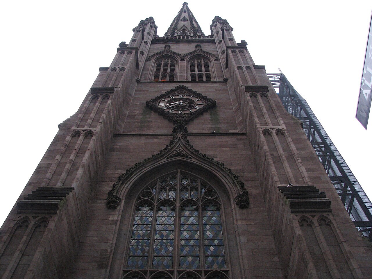 The dark stone front of Trinity Church on Broadway