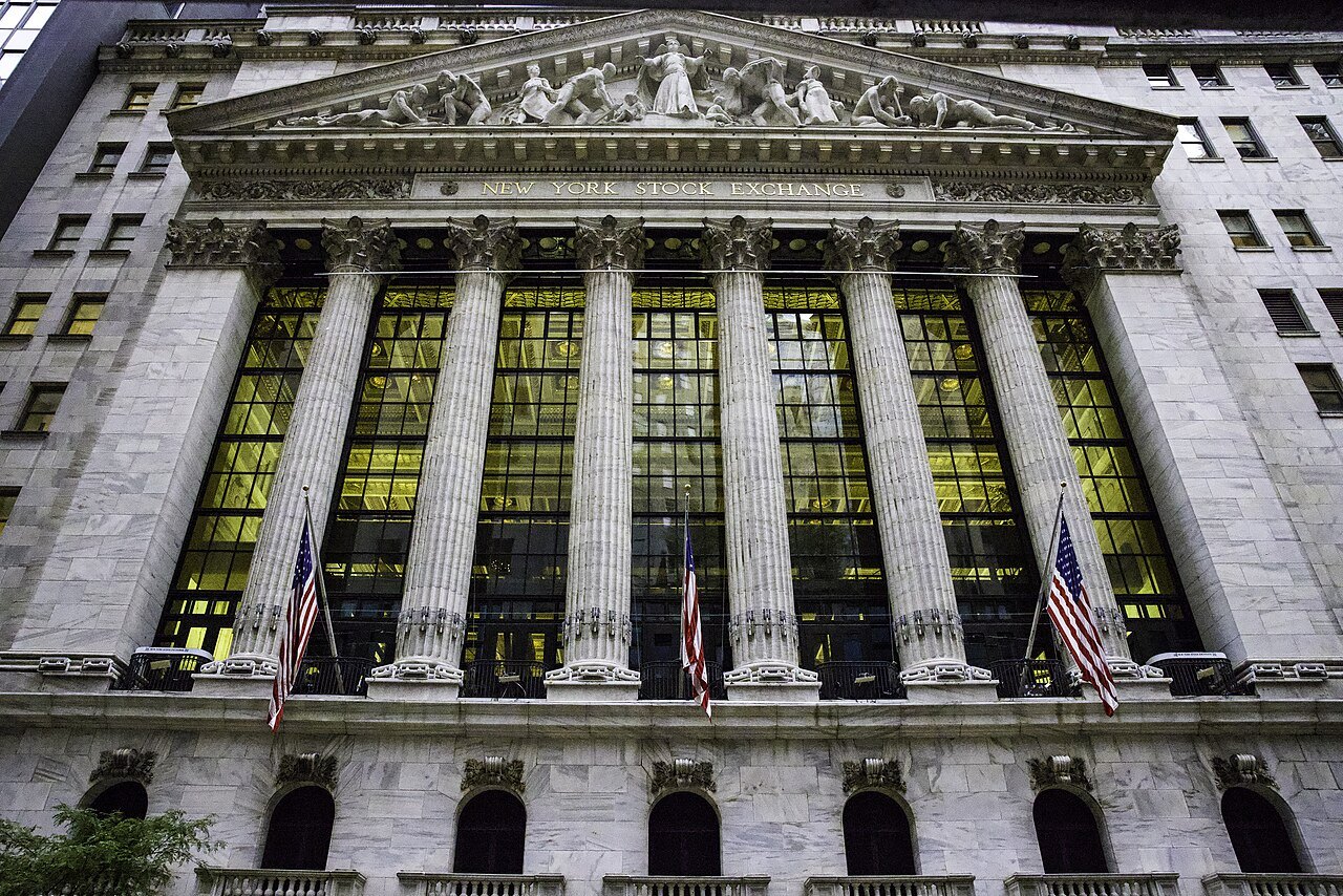 The New York Stock Exchange's facade lit at dusk
